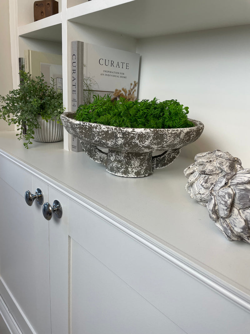Round rustic stone bowl on foot base