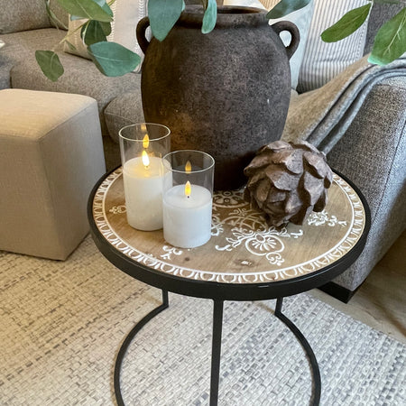 Store seconds Black metal table with embossed wooden top