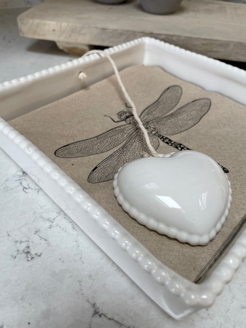 White ceramic napkin holder with weight